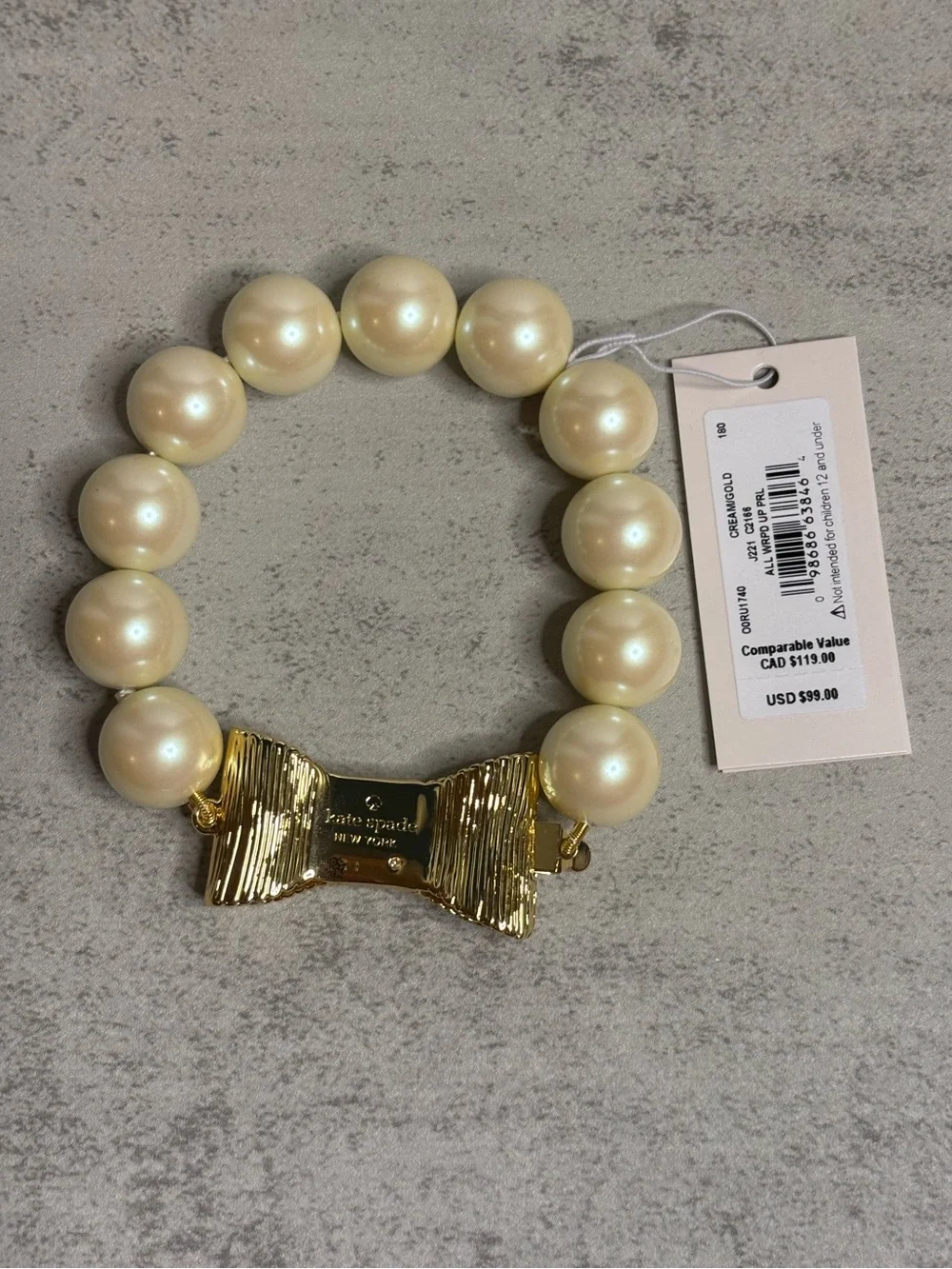 Kate Spade All Wrapped Up Faux Pearl Bracelet with Gold Bow Closure